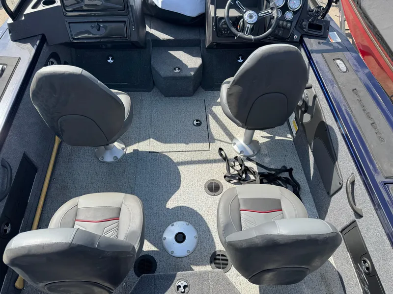 Slide: The Image of Interior of 2023 Tracker Targa V-18 WT boat with four seats and steering console. - 8