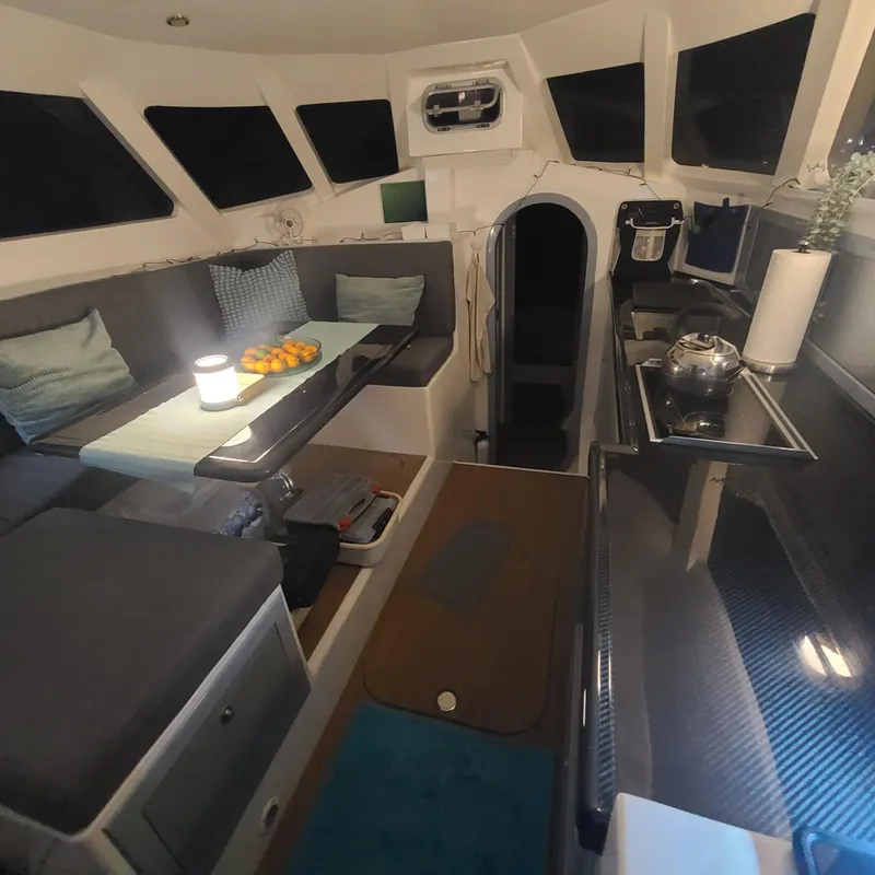 Slide: The Image of Interior of 2025 Rapido 40 yacht with modern seating and kitchen area. - 15