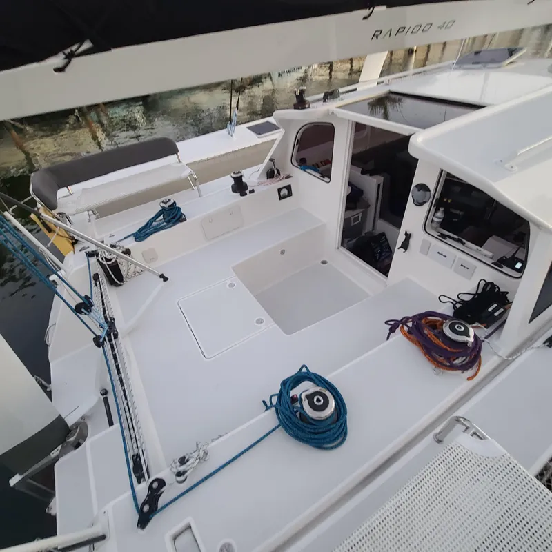 Slide: The Image of 2025 Rapido 40 sailboat deck with ropes and open cabin entrance. - 8