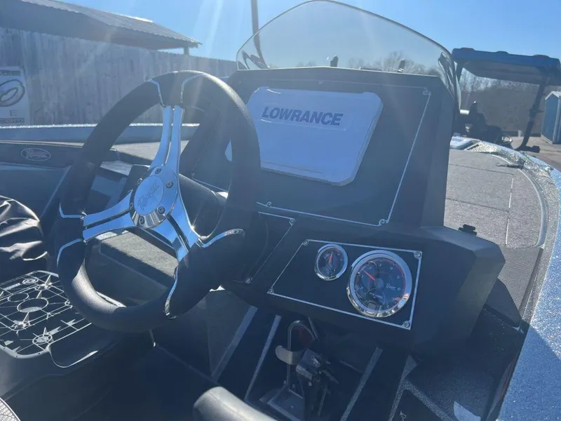 Slide: The Image of 2023 Ranger Z518 boat dashboard with Lowrance electronics and steering wheel. - 3