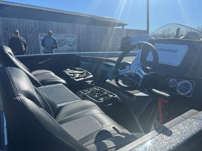 Slide: The Image of 2023 Ranger Z518 boat interior with steering wheel and seats. - 4