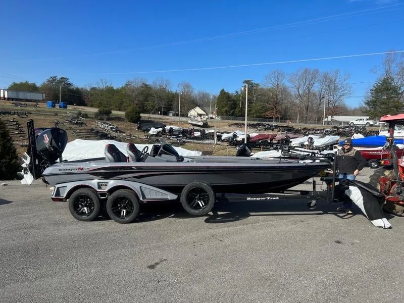 The Image of 2023 Ranger Z521R Cup Anniversary boat on a trailer in a parking lot. - 0