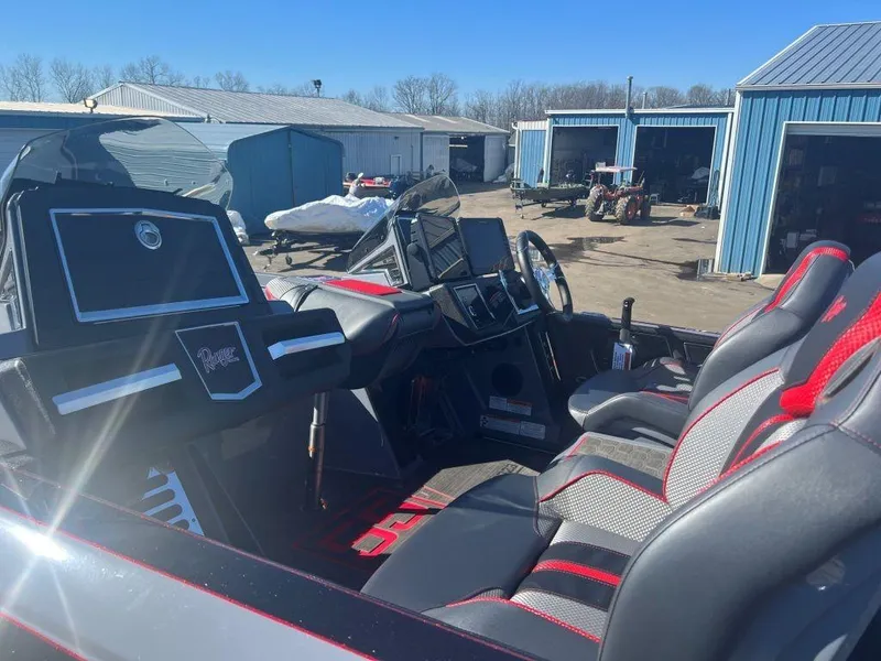 Slide: The Image of 2023 Ranger Z521R Cup Anniversary boat interior with modern dashboard and seating. - 5