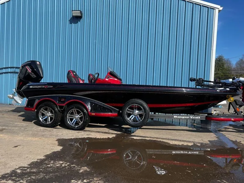 The Image of 2023 Ranger Z520R Ranger Cup Equipped boat parked outside a blue building. - 1