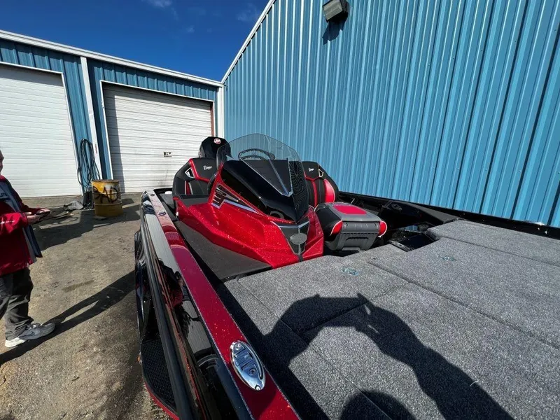 Slide: The Image of 2023 Ranger Z520R Ranger Cup Equipped boat parked outside blue building. - 12