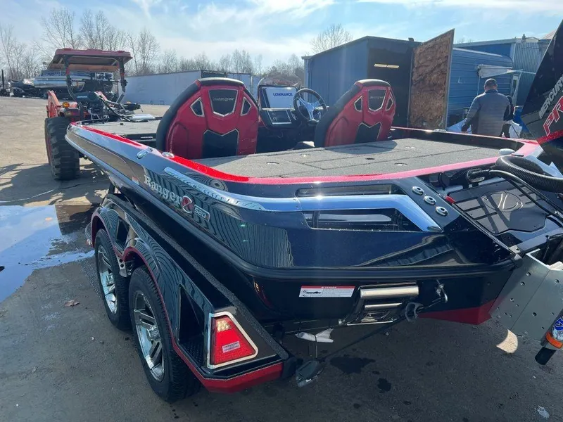 Slide: The Image of 2023 Ranger Z520R Ranger Cup Equipped boat with red and black design on a trailer. - 19