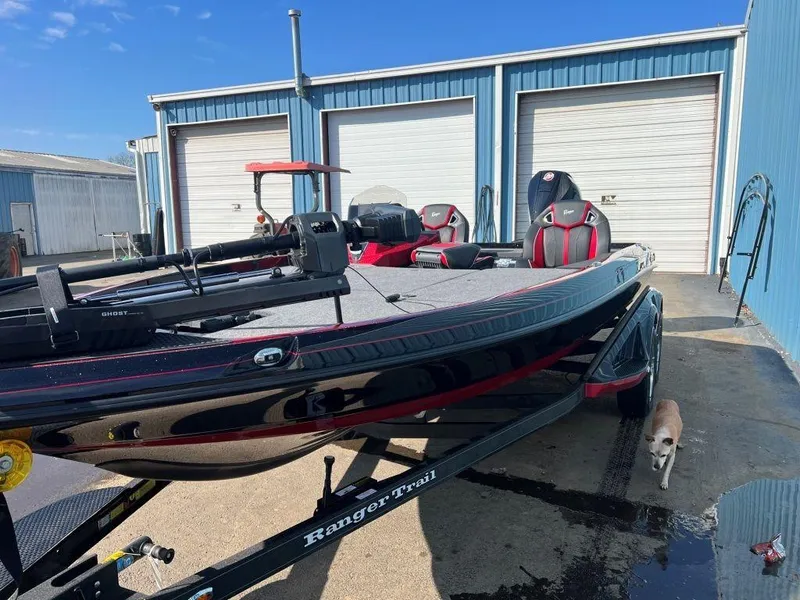 Slide: The Image of 2023 Ranger Z520R Ranger Cup Equipped boat parked outside blue storage units. - 21