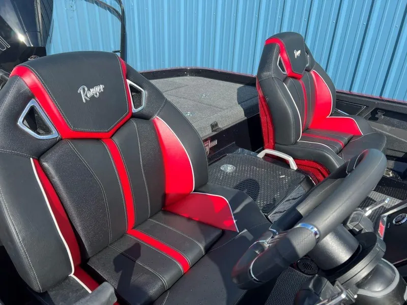Slide: The Image of 2023 Ranger Z520R Ranger Cup Equipped boat interior with black and red seats. - 24