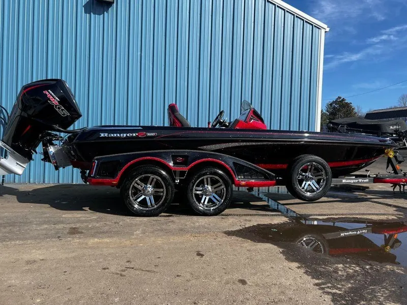 Slide: The Image of 2023 Ranger Z520R Ranger Cup Equipped boat with trailer, black and red, parked outside. - 4