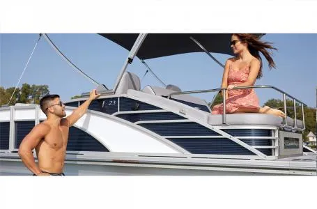 Slide: The Image of 2023 Bennington 23 LXSB pontoon boat with people enjoying the deck. - 10
