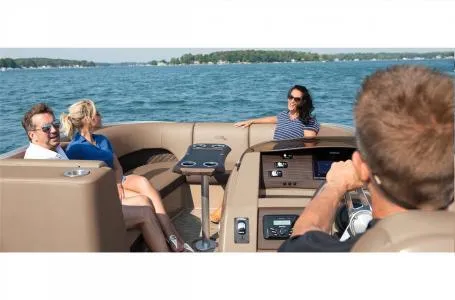 Slide: The Image of 2023 Bennington 23 LXSB pontoon boat with passengers enjoying a lake cruise. - 15