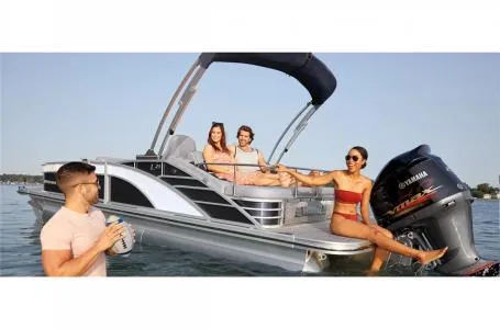 Slide: The Image of 2023 Bennington 23 LXSB pontoon boat with people enjoying on the water. - 4