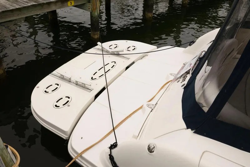 Slide: The Image of 2008 Sea Ray 44 Sundancer docked, showing swim platform and stern area. - 15