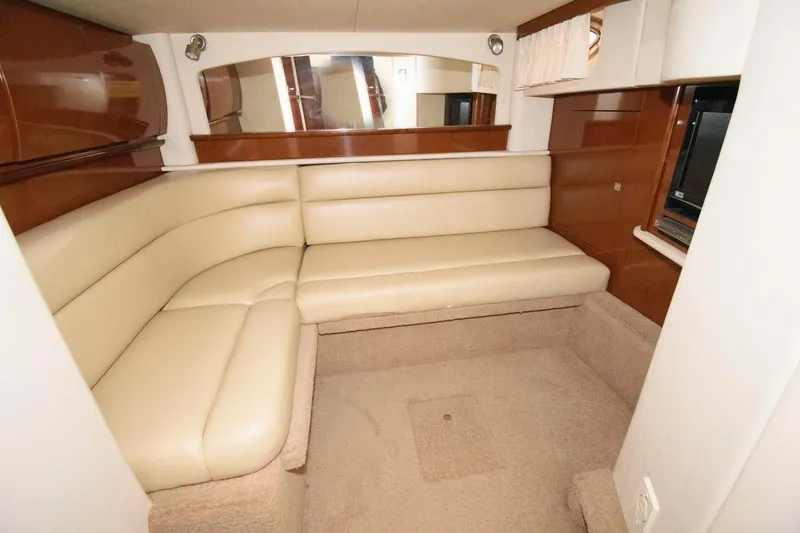 Slide: The Image of Luxurious interior of 2008 Sea Ray 44 Sundancer with beige leather seating and wood accents. - 22
