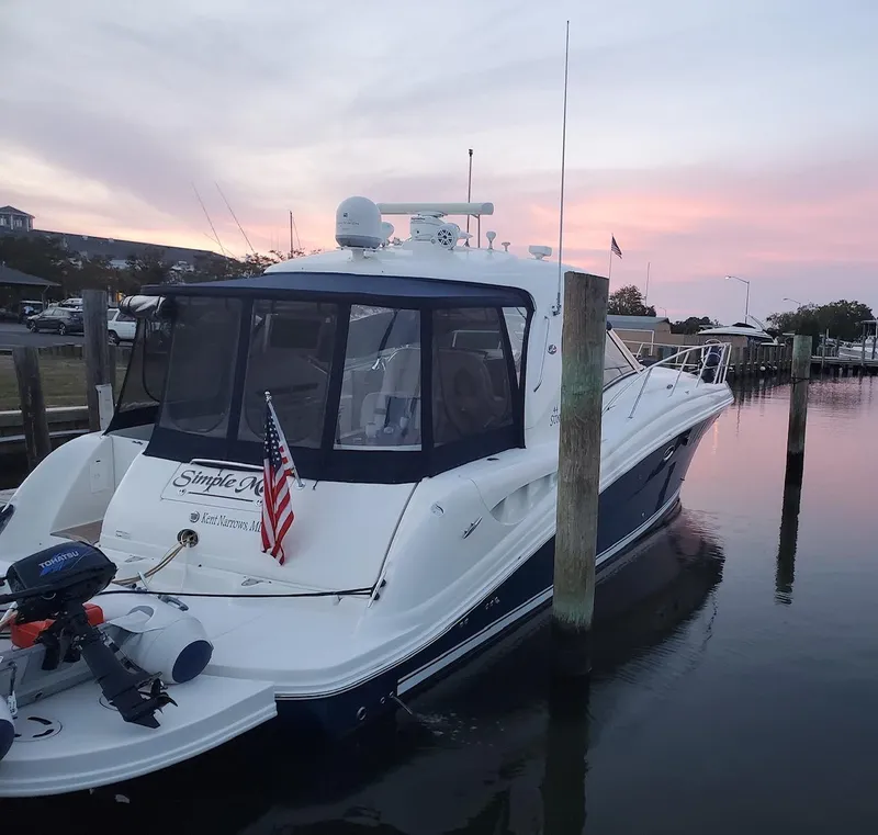 Slide: The Image of 2008 Sea Ray 44 Sundancer yacht docked at sunset with American flag. - 4