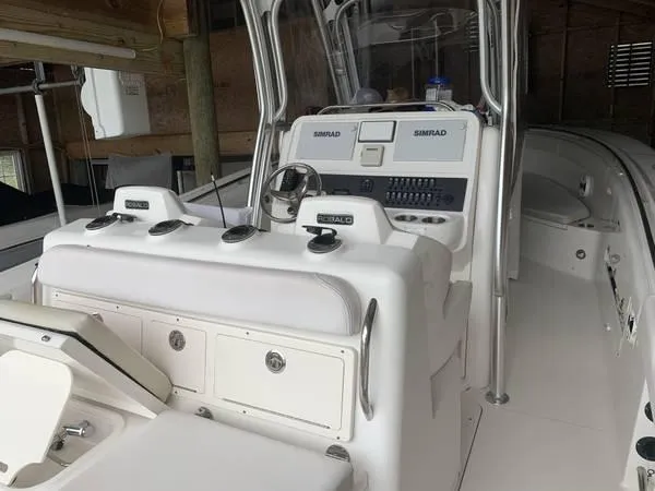 Slide: The Image of 2016 Robalo R300 Center Console boat interior with Simrad electronics. - 15