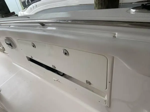 Slide: The Image of 2016 Robalo R300 Center Console boat storage compartment. - 18