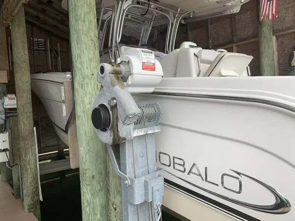 Slide: The Image of 2016 Robalo R300 Center Console boat in docked storage. - 5