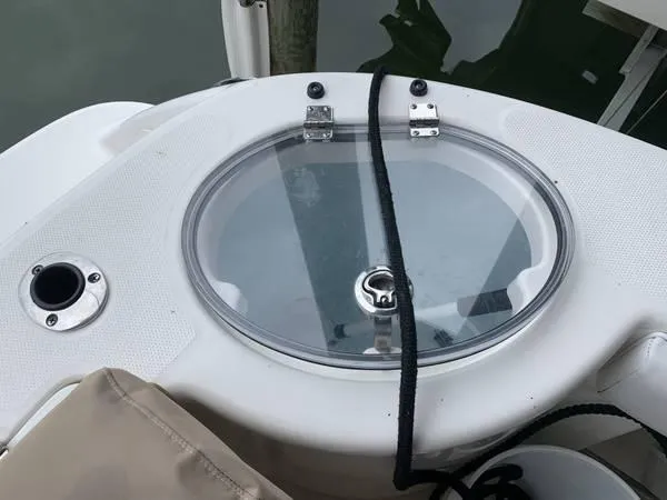 Slide: The Image of Livewell on 2016 Robalo R300 Center Console boat, featuring a clear lid and secure latch. - 8