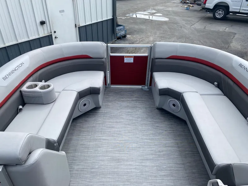 Slide: The Image of 2023 Bennington 21 SXSB pontoon boat interior with gray and red seating. - 7