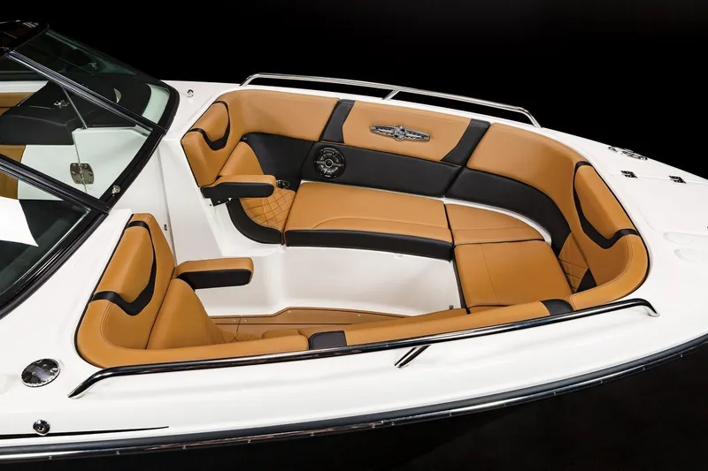 Slide: The Image of 2024 Chaparral 287 SSX boat interior with tan and black seating. - 15