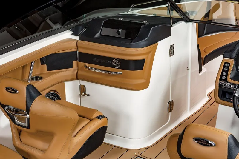 Slide: The Image of 2024 Chaparral 287 SSX boat interior with tan leather seats and modern dashboard. - 5