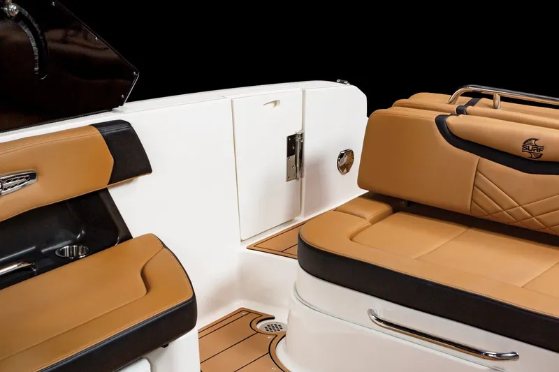 Slide: The Image of 2024 Chaparral 287 SSX boat interior with tan and black seating. - 9