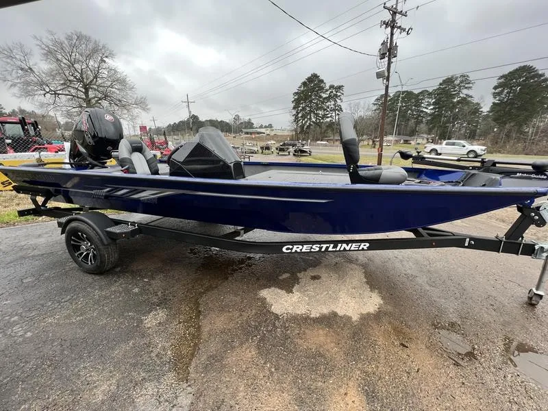 Slide: The Image of 2023 Crestliner XFC 189 fishing boat on trailer, parked outdoors. - 3