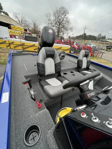 Slide: The Image of 2023 Crestliner XFC 189 boat interior with dual seats and control panel. - 7
