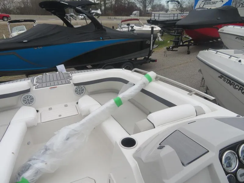 Slide: The Image of 2023 Starcraft SVX 211 OB boat interior, white seating, and wrapped accessory. - 15