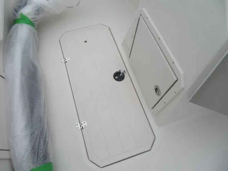 Slide: The Image of 2023 Starcraft SVX 211 OB boat storage compartment and hatch. - 17