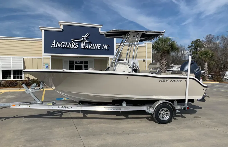 Slide: The Image of 2024 Key West 203 FS boat on trailer at Anglers Marine NC dealership. - 0