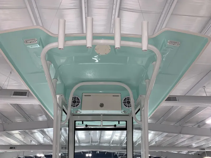 Slide: The Image of 2024 Robalo 266 Cayman boat T-top with rod holders and speakers. - 19