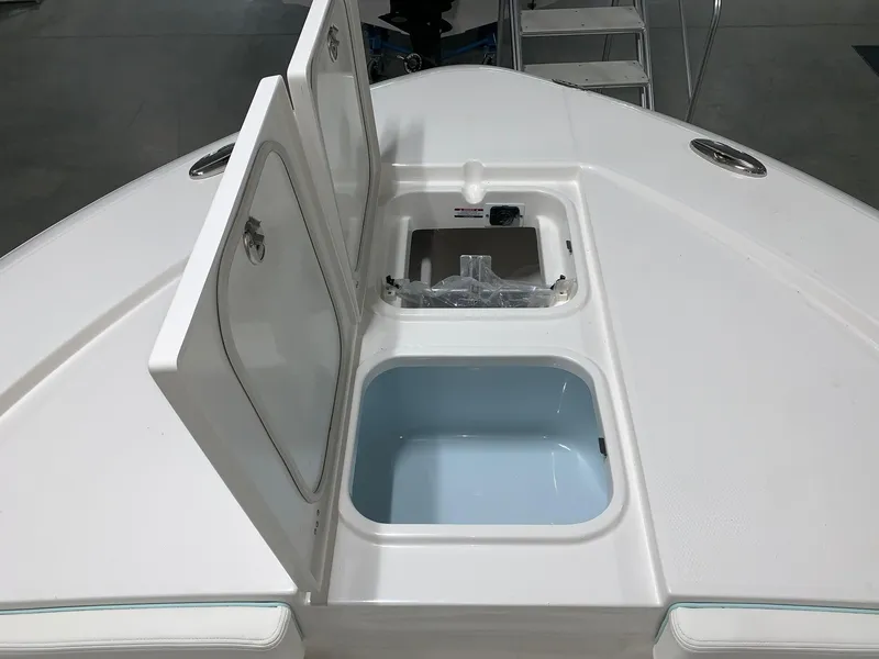 Slide: The Image of 2024 Robalo 266 Cayman boat storage compartments and livewell. - 8