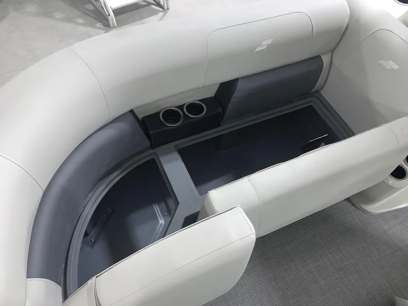 Slide: The Image of 2024 Starcraft LX22 R boat interior with cushioned seating and cup holders. - 6