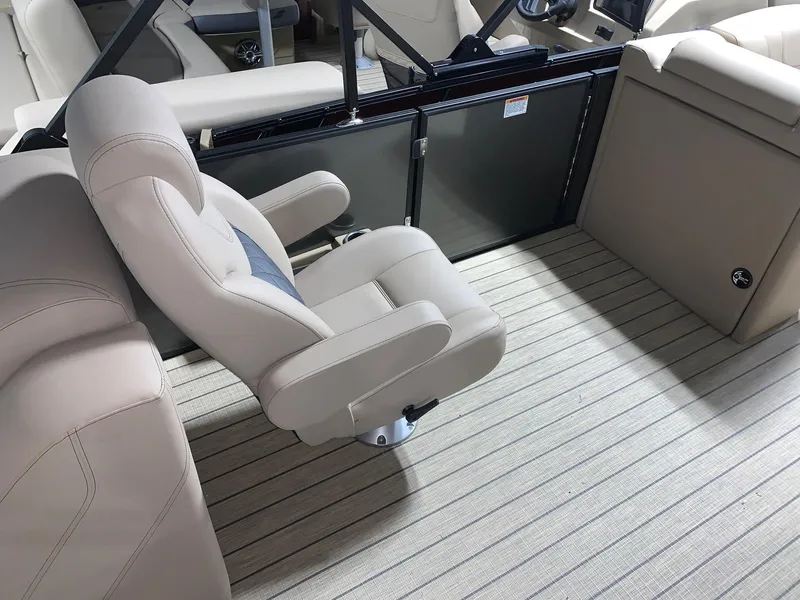 Slide: The Image of 2024 Starcraft SLS 3 boat interior with beige seating and flooring. - 6