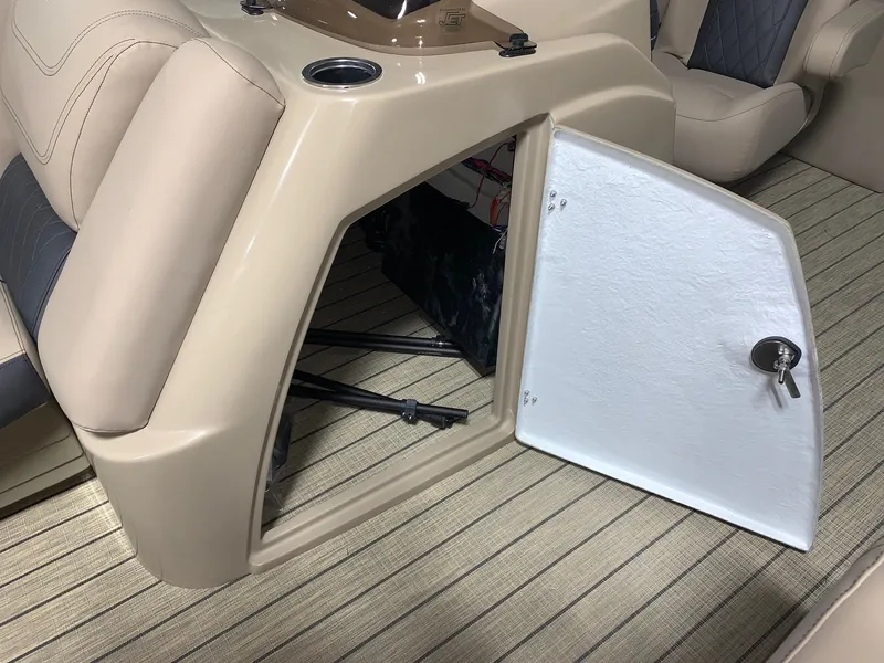Slide: The Image of 2024 Starcraft SLS 3 boat interior storage compartment with open door. - 9