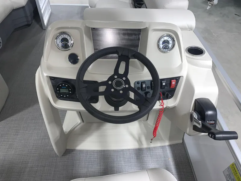Slide: The Image of 2024 Starcraft LX22 R boat dashboard with steering wheel and control panel. - 9
