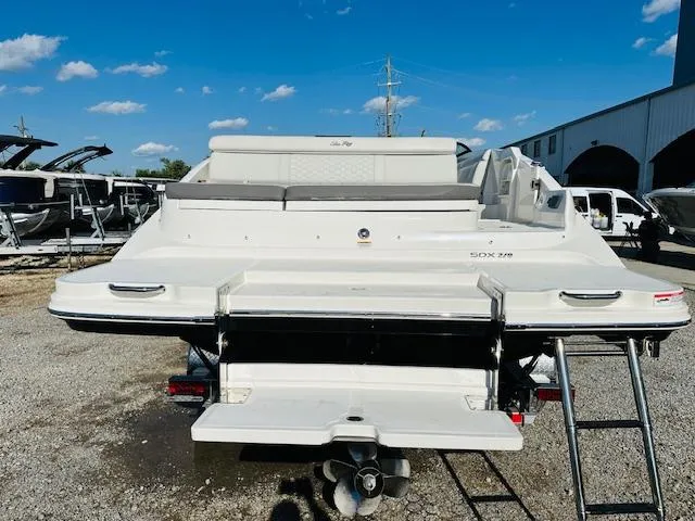 Slide: The Image of 2021 Sea Ray 270 SDX boat rear view with swim platform and ladder. - 10