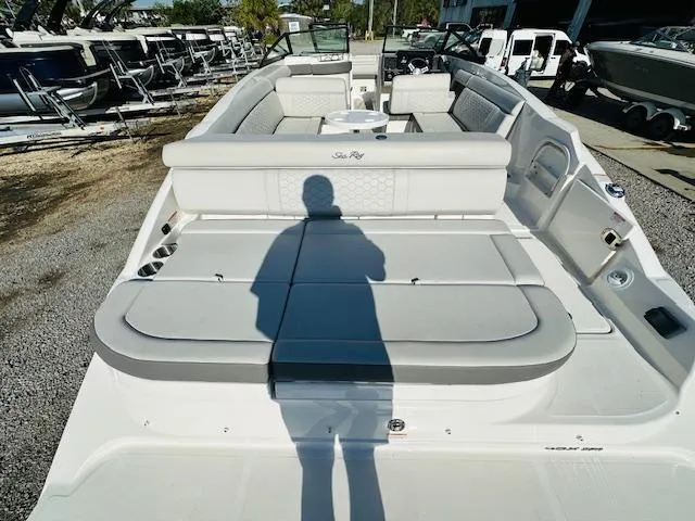 Slide: The Image of 2021 Sea Ray 270 SDX boat with spacious seating and modern design. - 11