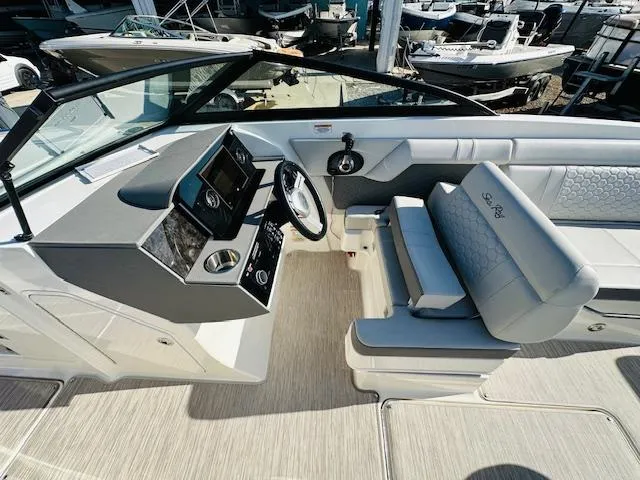 Slide: The Image of 2021 Sea Ray 270 SDX boat interior with helm and seating. - 19