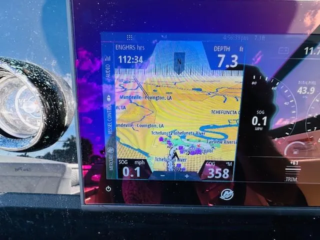 Slide: The Image of Sea Ray 270 SDX 2021 boat navigation display showing depth, speed, and map. - 21