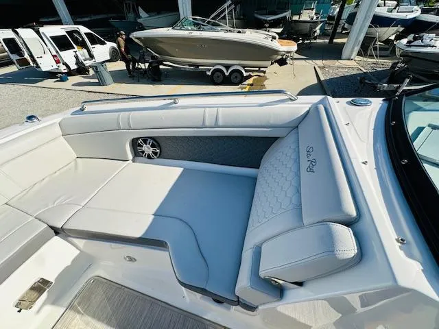 Slide: The Image of 2021 Sea Ray 270 SDX boat with spacious seating area and modern design. - 25