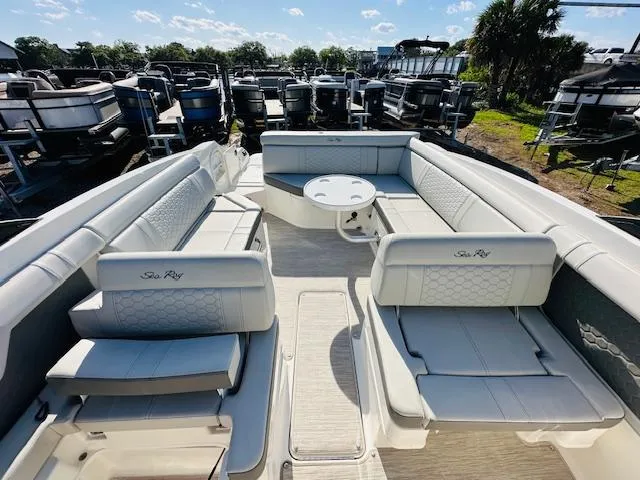 Slide: The Image of 2021 Sea Ray 270 SDX boat interior with spacious seating and table. - 28