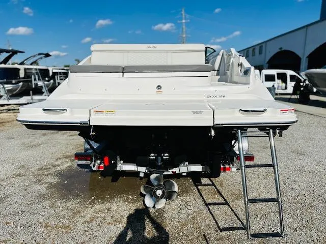 Slide: The Image of 2021 Sea Ray 270 SDX boat rear view with ladder and propeller. - 6