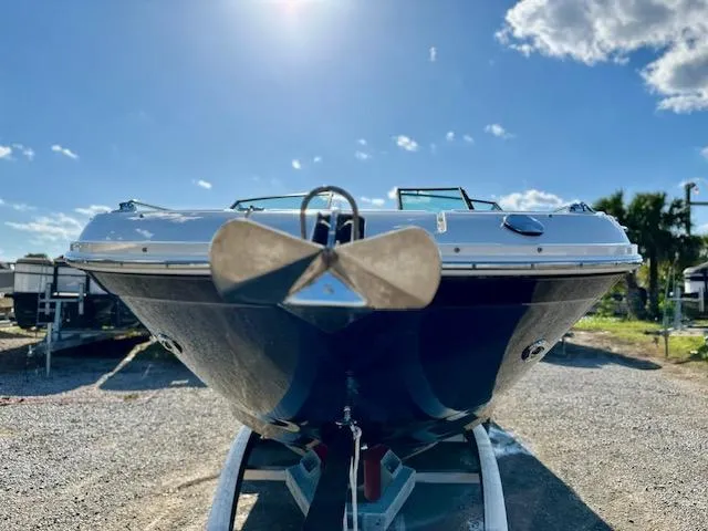 Slide: The Image of 2021 Sea Ray 270 SDX boat on trailer, front view under sunny sky. - 9