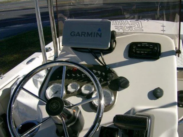 Slide: The Image of 2021 Carolina Skiff 17 LS boat dashboard with Garmin GPS and steering wheel. - 6