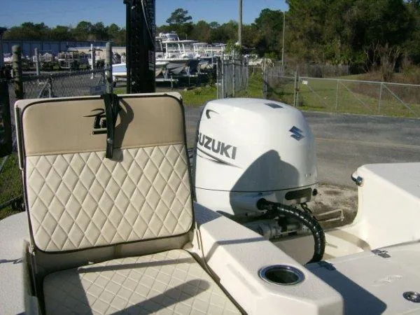 Slide: The Image of 2021 Carolina Skiff 17 LS boat with Suzuki outboard motor and beige seating. - 8