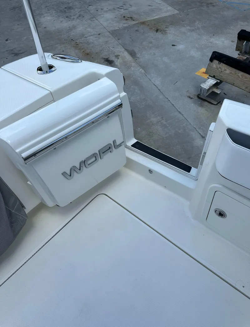 Slide: The Image of 2021 World Cat 400 DC-X boat interior, white deck and seating area. - 19