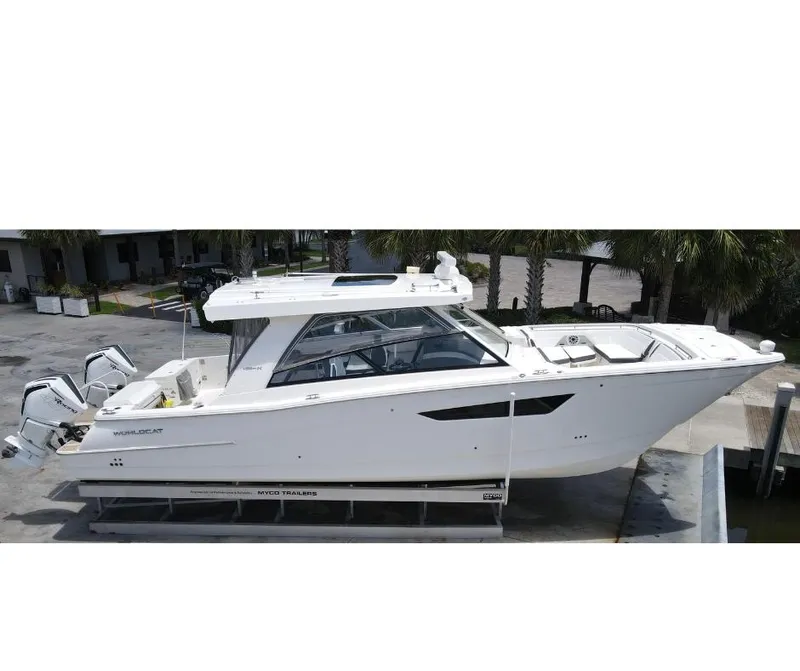 Slide: The Image of 2021 World Cat 400 DC-X boat on trailer, side view. - 2